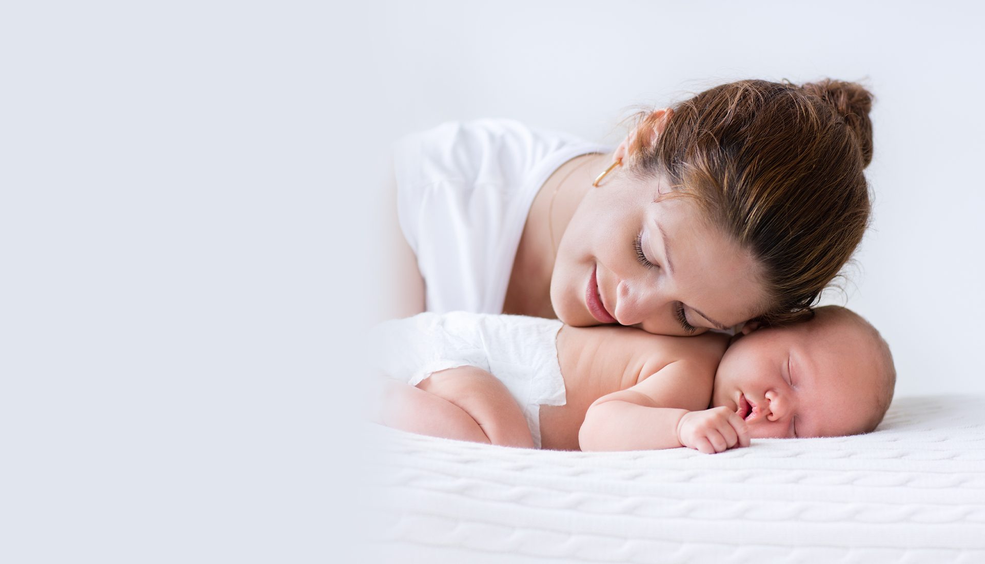 mom and baby napping